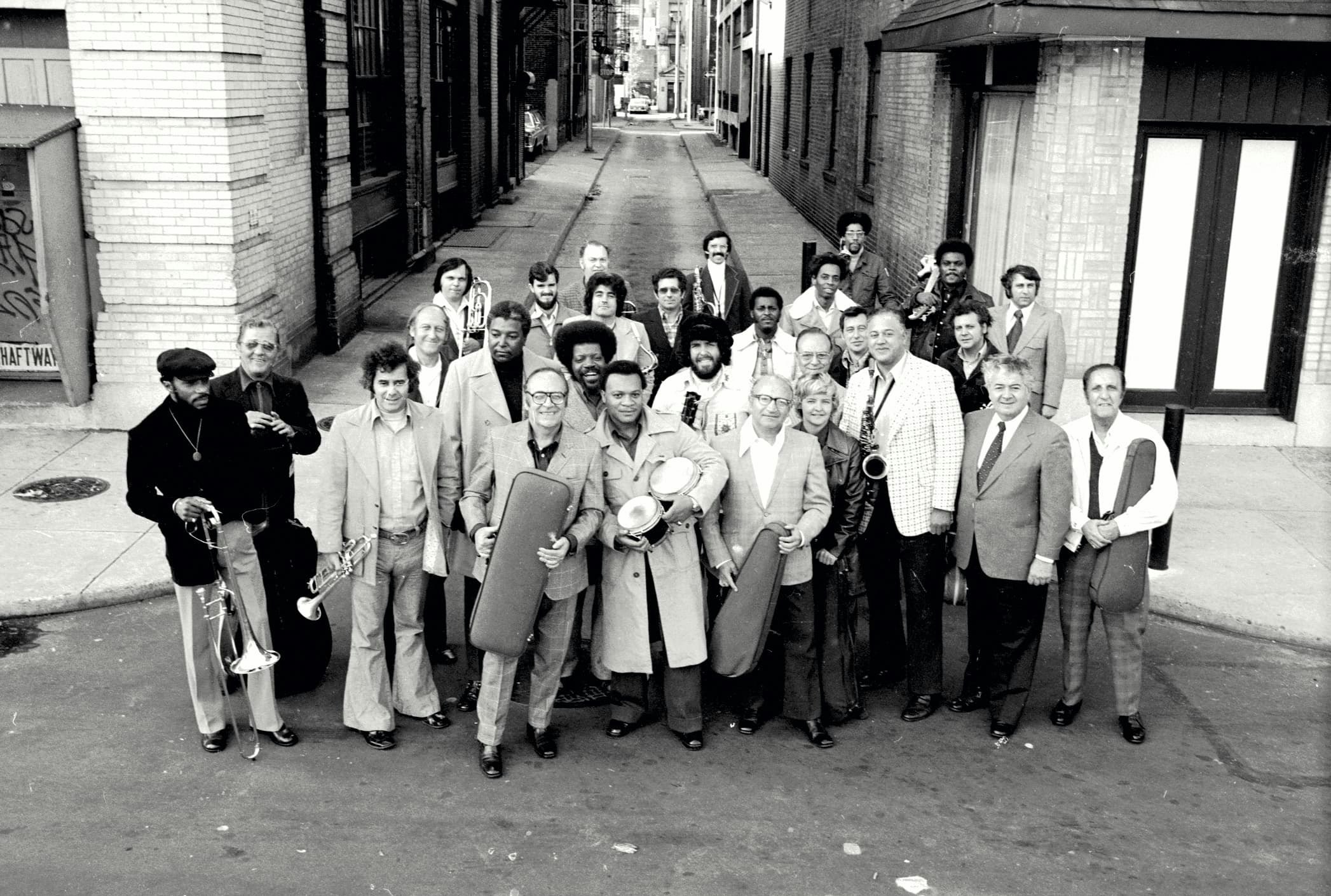 Vince Montana Jr. (far right, middle) and members of MFSB (and Sigma session players) outside of Sigma Sound Studios, Philadelphia. Photo by Don Hunstein and courtesy of Sony Music Entertainment Archives.